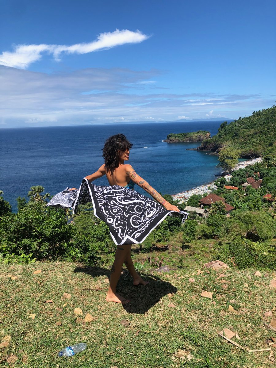 Fabric spread against the coastline